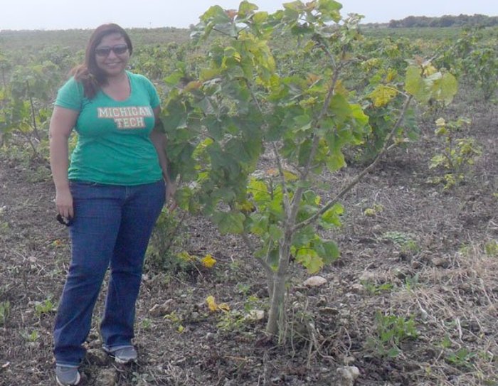 PhD Candidate from Mexico Mayra Sanchez Gonzalez is shown with a Jatropha plant, which is used for biofuel in her native Yucatan, Mexico.