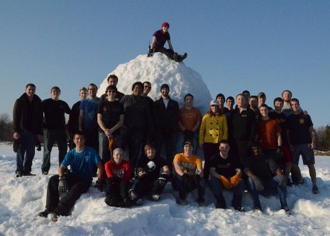 Michigan Tech students gather around the Guinness World Record snowball they created last spring.