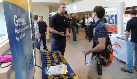 Students talk with representatives from Gerdau, a major steel industry company.