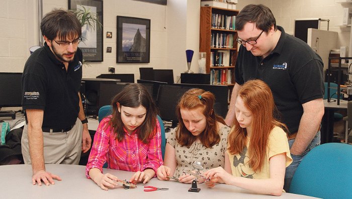 Heart Monitor Students Blue Marble Security Enterprise students help middle schoolers assemble a heart monitor from a kit designed and built by the Enterprise. From the left, Philip Wolschendorf, Olivia Hohnholt, Hannah Hansen, Geneva Archer and Mike Switala.