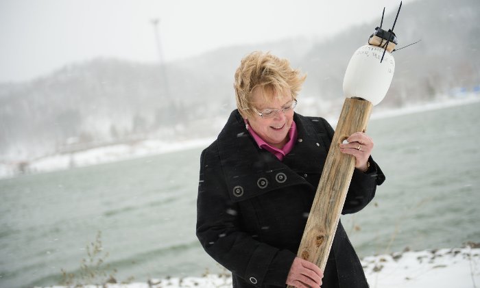 Biological Sciences  Professor Nancy Auer with the drifter that traveled all the way across Lake Superior. 