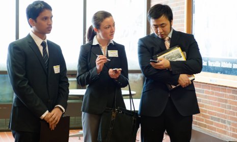 International students discuss opportunities with an employer representative at last spring's Career Fair.