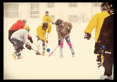 Students playing broomball.