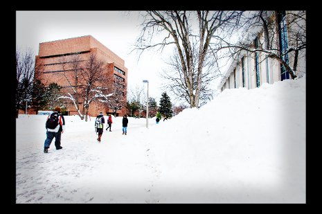 Students walking though campus near the Library.