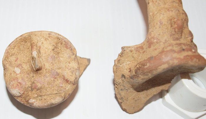 The St. Thomas Dig A face and a handle (?) from the past.