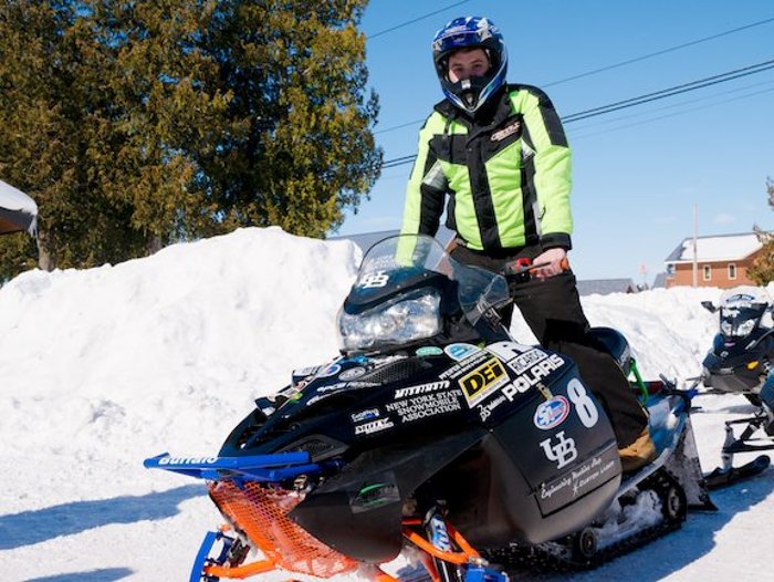 Driver Noor Jariri and the SUNY Buffalo sled, which completed the 2014 SAE Clean Snowmobile Challenge Endurance Run.