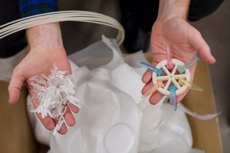 Joshua Pearce holds a DremelFuge chuck made from shredded plastic milk jugs.