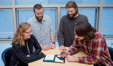 Graduate students Lindsey Watch, Cameron Goble, Tony Mathys and Luke Bowman are learning to communicate science to school children and the public.