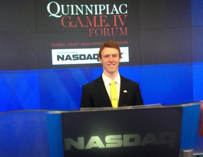 Heath Johnson at the NASDAQ closing with the winning APMP Gold Team.