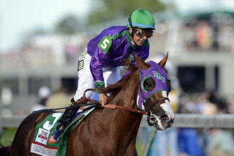 Victor Espinoza rides California Chrome to victory at the Kentucky Derby.