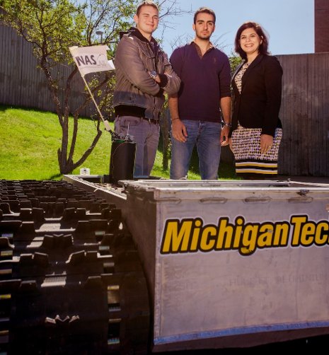 Nina Mahmoudian, right, with students Daryl Bennett, left, and Barzin Moridian. The team has demonstrated in their lab how robots can restore electricity after power outages. Next are real-world experiments using this life-size robotic vehicle.