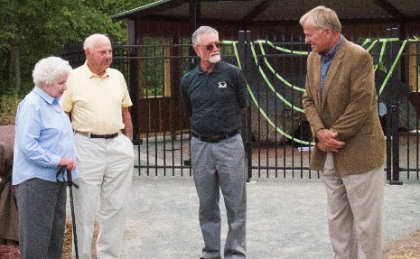 Jane and John Matz chat with A.E. Seaman Mineral Museum Executive Director Ted Bornhorst and Michigan Tech President Glenn Mroz prior to the dedication of the Copper Pavilion Monday.