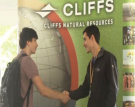 A Michigan Tech student meets with a representative of Cliffs Natural Resources during Steel Days in 2014.