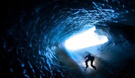 Ice Cave A researcher rappels into an ice cave in Svalbard, an archipelago in the Arctic Ocean off the northernmost tip of Europe. Photo by Jason Gulley