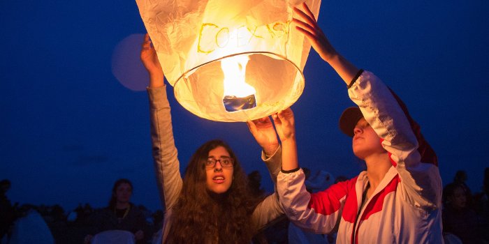 Yasmeen Jassim, left, a student from Bahrain, launches a sky lantern during the Women In Engineering program at Michigan Technological University.