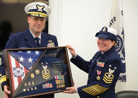 Nancy, right, Admiral Joseph Servidio are seen at her retirement from the Coast Guard Reserve.