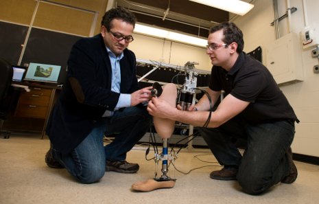 Mo Rastgaar Robotic Ankle Mo Rastgaar (left) and PhD candidate Evandro Ficanha test the new robotic ankle that can "see" where it's going.