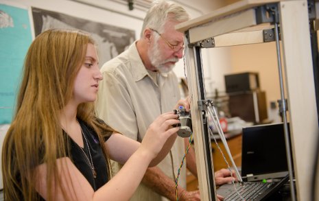 Jill Poliskey, a Portage Health Foundation undergraduate research scholar,  works with Eric Friesen from Nicaragua to build 3-D printing technology for students in his country. 