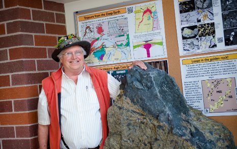 Professor Emeritus Bill Rose with the 3.5 ton nickel-copper sulfide boulder from the Eagle Mine.