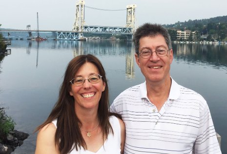 Liza and Donn Schneider are seen on the Houghton waterfront. The couple, from Green Bay, have established an endowed professorship and postdoctoral fellowship support in Michigan Tech's Department of Computer Science.