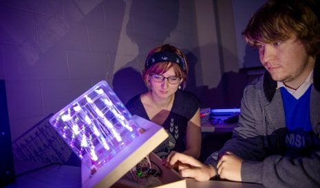 Students working in the Department of Electrical and Computer Engineering photonics lab.