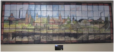 This clay mural of the Calumet community landscape was created by local artist Barbara Flanagin, in consultation with Ed Gray of the Calumet Art Center. This piece of work commissioned by Calumet Township Supervisor Paul Lehto is on display at Calumet Township Hall.