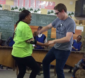 Michigan Tech student Spencer Carlson learns some moves during the Michigan Tech Concert Choir's tour of South Africa in May.