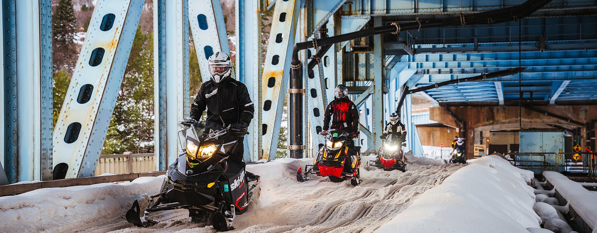 Students in the sledhead club riding across the Portage Lift Bridge