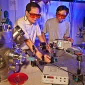 Scientists with lab equipment