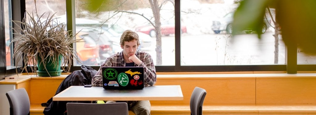Student sitting at a laptop
