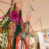 Yarn and fabric woven suspended in an installation in the Rozsa lobby