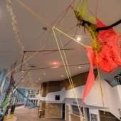 Another view of a yarn and fabric installation from the ceiling of the Rozsa lobby.
