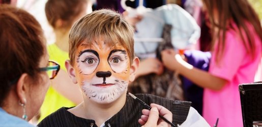 Child with tiger facepaint