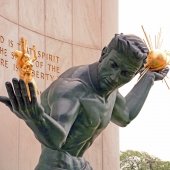 statue holding gold objects