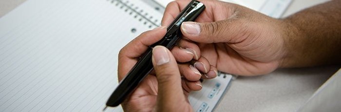hands holding a pen