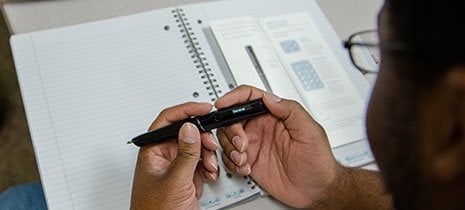 hands holding a pen