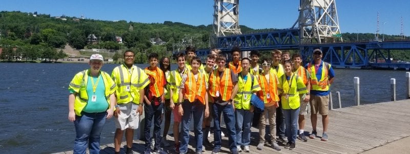 An SYP experience group stands in front of the Portage Lift Bridge.