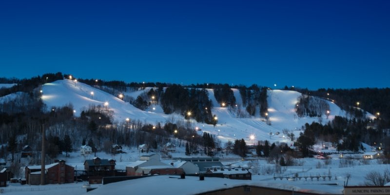 Mont Ripley Ski Area from across the waterway at night.