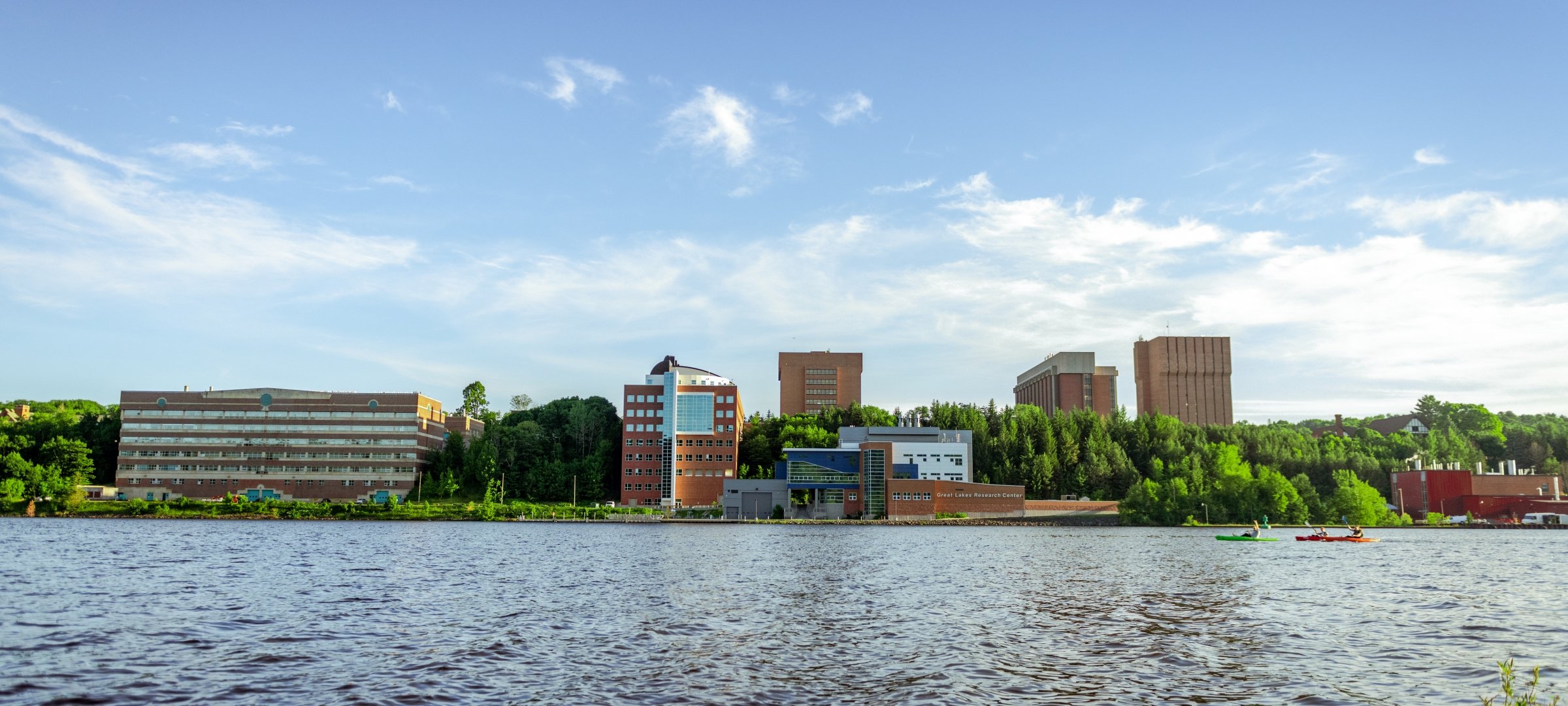 A view of campus from across the waterway.