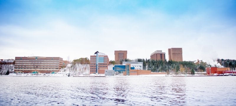 Campus in the winter with the Keweenaw Waterway in front..