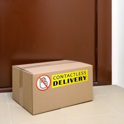 a box in front of a door that says touch-free delivery
