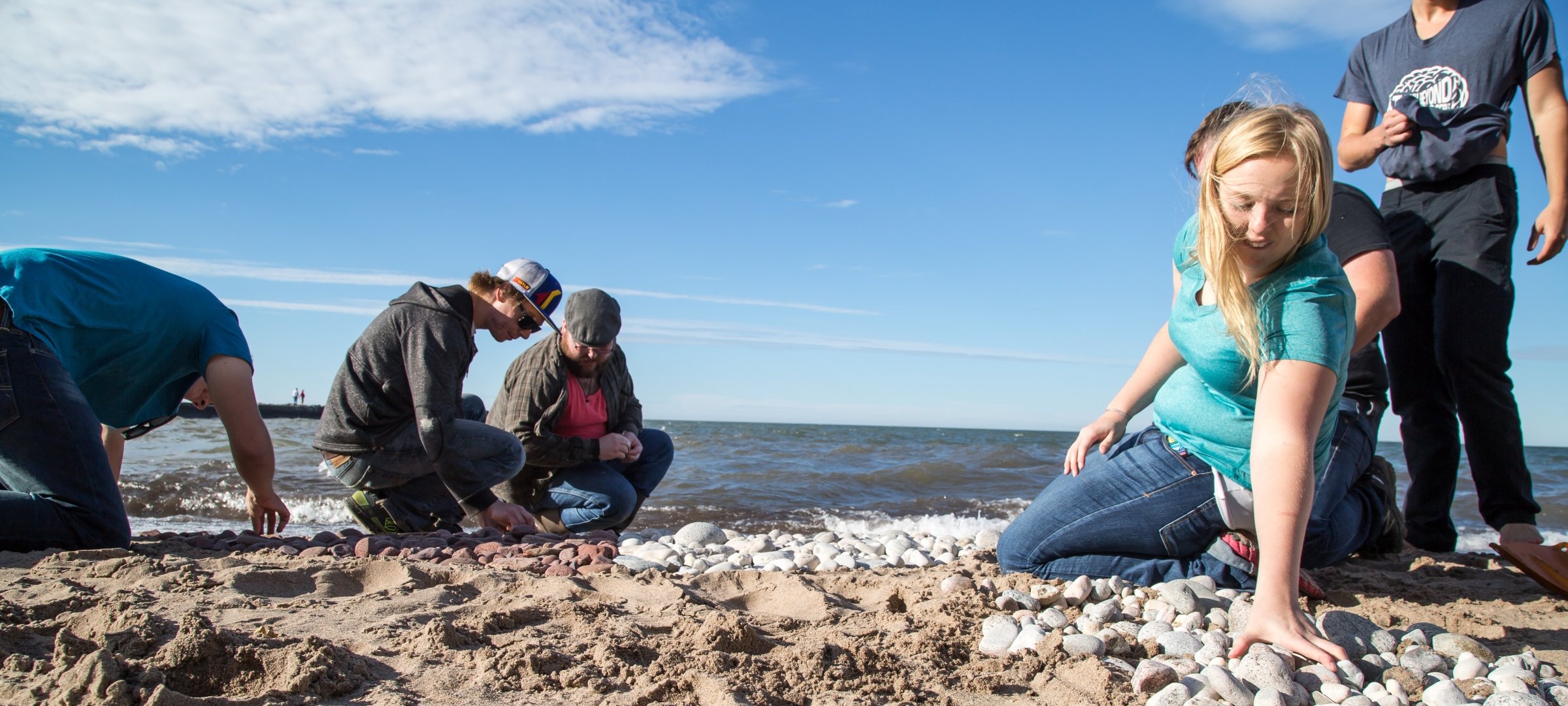 Students exploring the Lake Superior shoreline