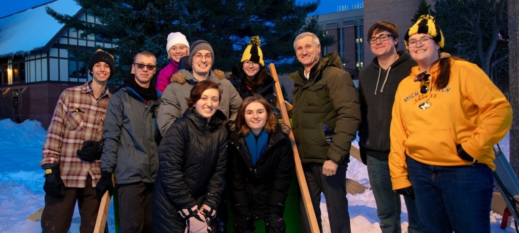 Students with President Koubek during Winter Carnival.