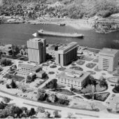 Aerial view of ore boat in the water behind campus.