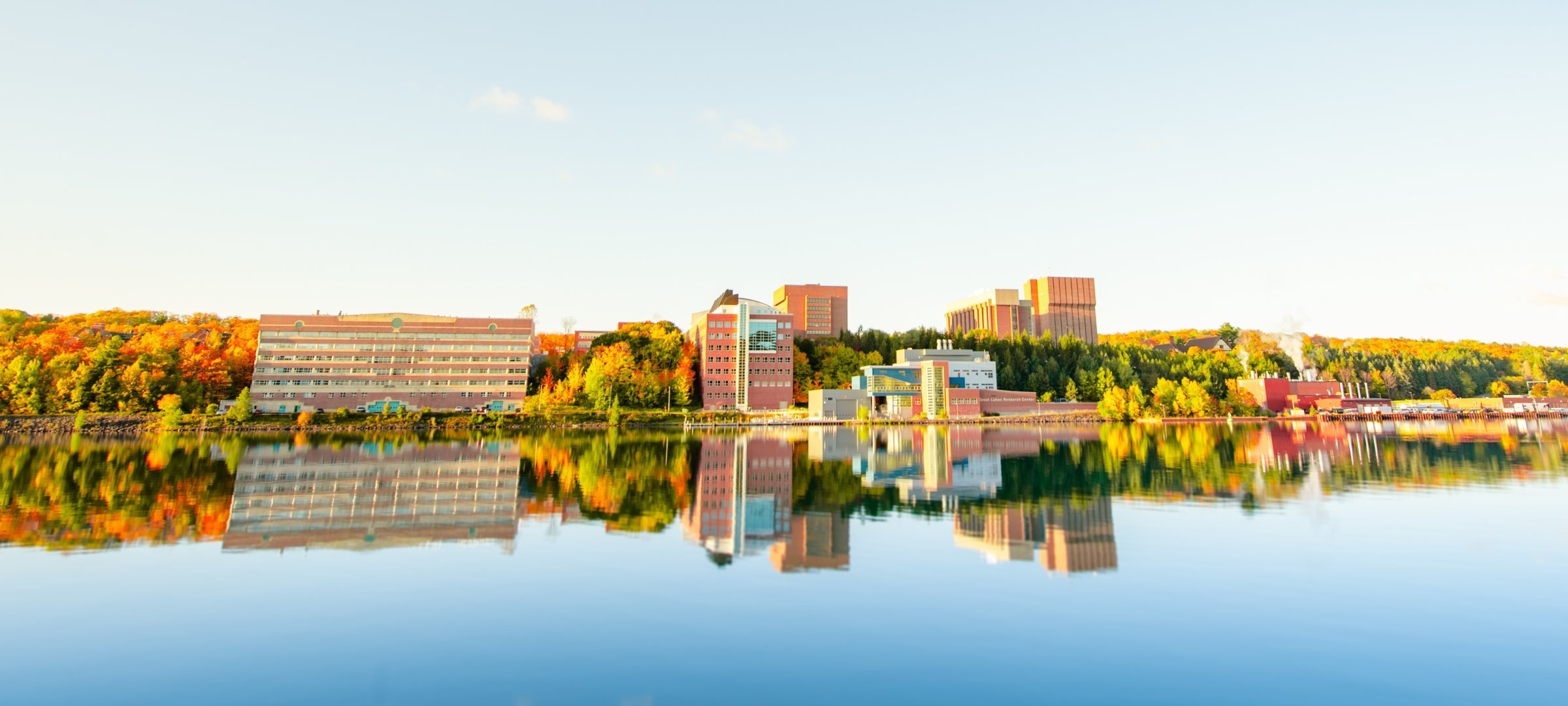 A view of the Michigan Tech campus from across the waterway.