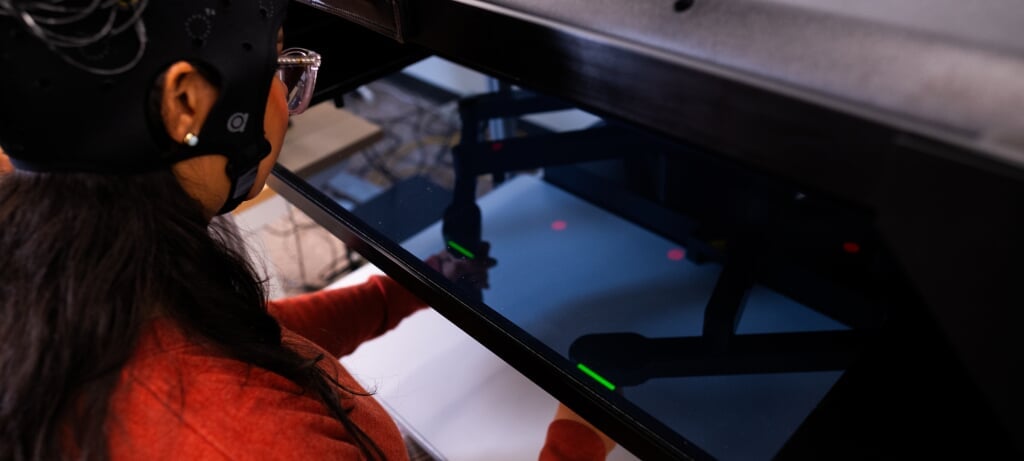 Studeng working with motion-tracking technology in a lab