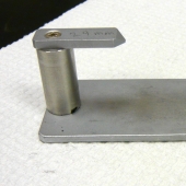 Metal height gauge with fixed height piece.