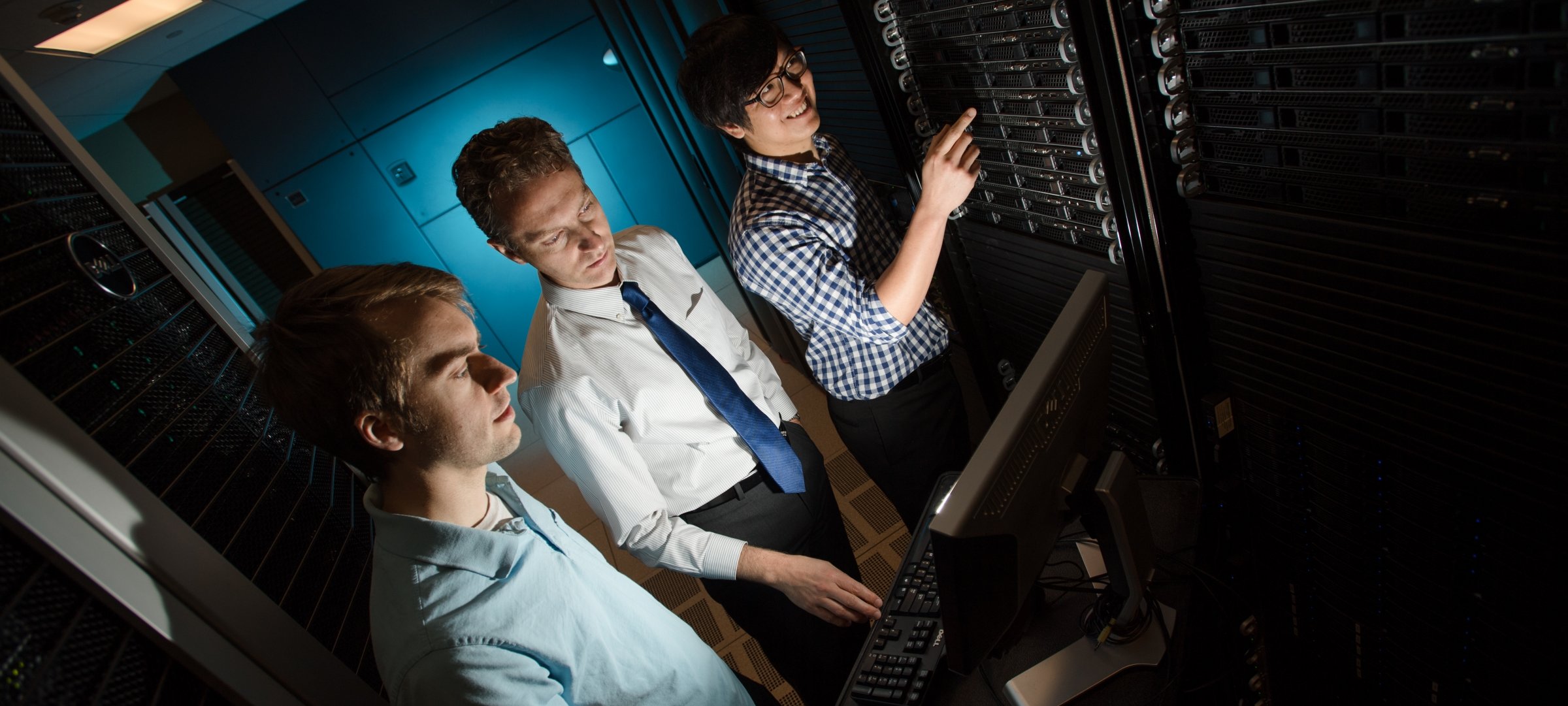 Computer Networking students working with servers.