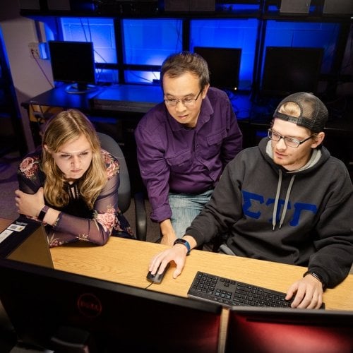 computing students looking at a monitor