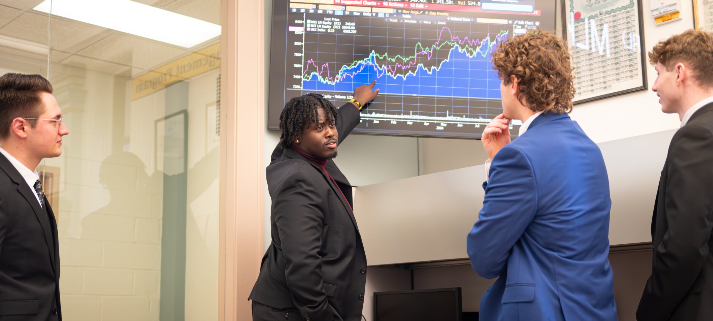 Students examining a Marks and Spenser Group equity chart